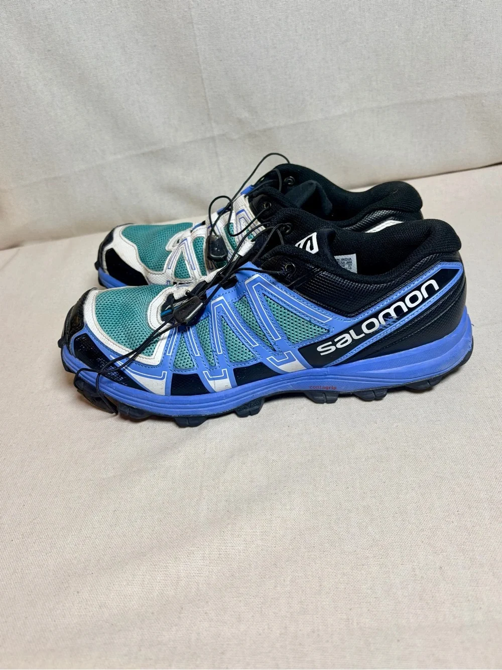 Salomon woman’s Sneakers in Teal, Blue, White and Black size 10